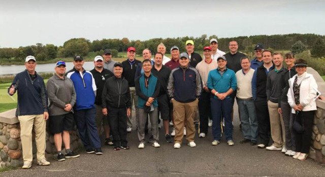 group photo of male golfers
