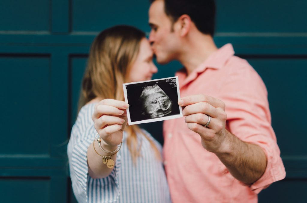 couple with their child's ultrasound